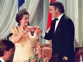 Queen Elizabeth II toasts with Prime Minister Brian Mulroney in Quebec City on Oct. 23, 1987.