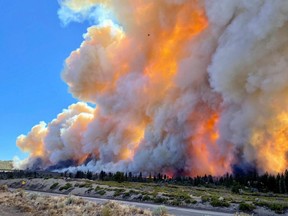 Smoke rises as the Mill Fire burns on the outskirts of Weed, Calif., Friday, Sept. 2, 2022, in this picture obtained from social media.