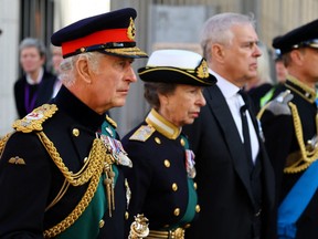 Britain's King Charles, Princess Anne, Prince Andrew and Prince Edward follow the hearse carrying the coffin of Britain's Queen Elizabeth in Edinburgh, Scotland, Monday, Sept. 12, 2022.