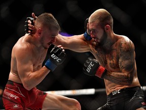 Britain fighter Nathaniel competes against Wood Canadian fighter Charles Jourdain  in their men's featherweight fight during the Ultimate Fighting Championship (UFC) Fight Night 209 event at the Paris-Bercy arena in Paris on Sept. 3, 2022.