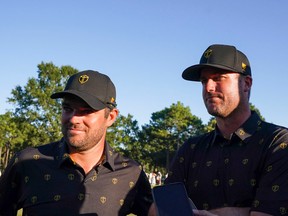 International Team golfers Corey Conners (left) and Taylor Pendrith (right) of Canada are interviewed after their four-ball match at the Presidents Cup on Friday at Quail Hollow Club.