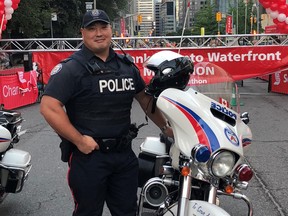 Const. Andrew Hong poses in this undated family handout photo. Toronto police say they're planning to have a book of condolences available to the public to mourn an officer killed this week. Hong was one of two people killed on Monday in a series of shootings across the Greater Toronto and Hamilton Area. THE CANADIAN PRESS/HO, Hong Family *MANDATORY CREDIT*