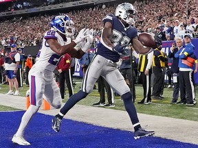 Dallas Cowboys wide receiver CeeDee Lamb (88) makes a touchdown catch over New York Giants cornerback Adoree' Jackson (22) at MetLife Stadium.