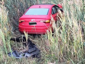 The red Volkswagen Jetta abandoned after a fatal crash on Hwy. 400 at Rutherford Rd. on Friday, Sept. 30, 2022.