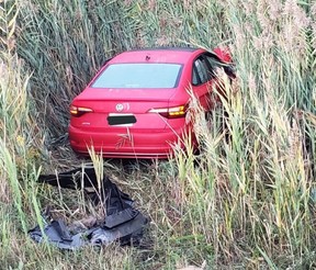 The red Volkswagen Jetta abandoned after a fatal crash on Hwy. 400 at Rutherford Rd. on Friday, Sept. 30, 2022. OPP PHOTO