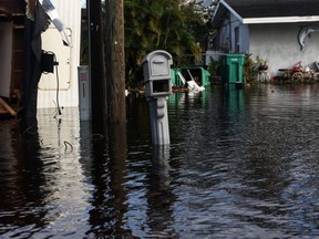 A mail box stands in flooded waters in front of damaged homes after Hurricane Ian made landfall in southwestern Florida, in Punta Gorda, Thursday, Sept. 29, 2022.