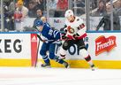 Maple Leafs prospect Fraser Minten (left) battles for the puck with Ottawa Senators defenceman Nikita Zaitsev at Scotiabank Arena on Saturday afternoon.