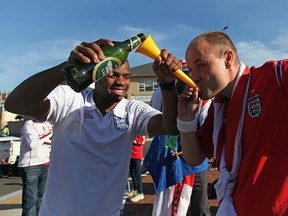 An English fan drinks beer through a vuvuzela outside Nelson Mandela Bay Stadium on June 23, 2010 in Port Elizabeth, South Africa. England play Slovenia at the Nelson Mandela Bay Stadium today in the third and final of their group stage matches where England need a win to continue to the next round.  (Photo by Dan Kitwood/Getty Images)