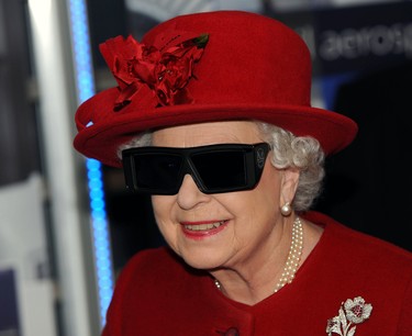 Queen Elizabeth II  wears 3 D glasses to watch a display and pilot a JCB digger, during a visit to the University of Sheffield Advanced Manufacturing Research centre, on November 18, 2010 in Sheffield, England. (John Giles - WPA Pool/Getty Images)