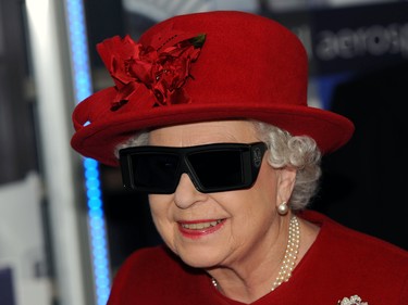 SHEFFIELD, ENGLAND - NOVEMBER 18: Queen Elizabeth II  wears 3 D glasses to watch a display and pilot a JCB digger, during a visit to the University of Sheffield Advanced Manufacturing Research centre, on November 18, 2010 in Sheffield, England. (Photo by John Giles - WPA Pool/Getty Images)