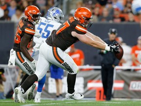 Travis Vornkahl #77 of the Cleveland Browns catches a pass off of a deflection during the second quarter of the preseason game against the Detroit Lions at FirstEnergy Stadium on August 29, 2019 in Cleveland, Ohio.