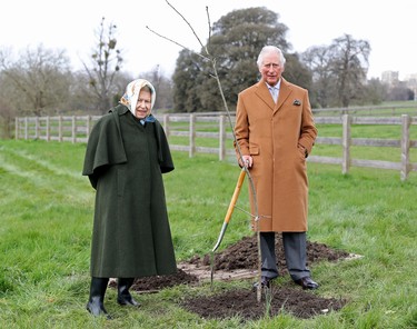 Queen Elizabeth II and The Prince of Wales with the first Jubilee tree in the grounds of Windsor Castle earlier this year, on March 23, 2021 in Windsor, England. The tree was planted by The Prince of Wales to launch The Queen’s Green Canopy (QGC), a unique, UK-wide tree planting initiative created to mark Her Majesty’s Platinum Jubilee in 2022, of which His Royal Highness is Patron. (Photo by Chris Jackson/Getty Images)