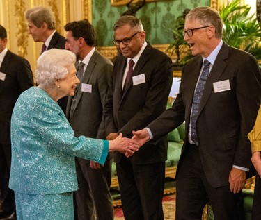Britain's Queen Elizabeth II (L) greets Microsoft co-founder turned philanthropist Bill Gates (R) during a reception for international business and investment leaders at Windsor Castle to mark the Global Investment Summit on October 19, 2021 in Windsor, England.  (Arthur Edwards-Pool/Getty Images)