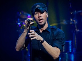 Spanish singer Enrique Iglesias performs during the Enrique Iglesias and Ricky Martin Live in Concert joint tour at the FTX Arena in Miami, Florida on October 22, 2021.