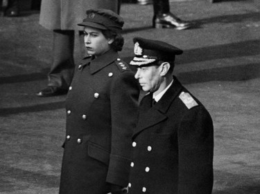 Princess Elizabeth of York and King George VI in ATS uniform stand at the Cenotaph during the first time armistice ceremony since 1938, on November 11, 1945, in London. (Photo by PLANET NEWS / AFP) (Photo by -/PLANET NEWS/AFP via Getty Images)