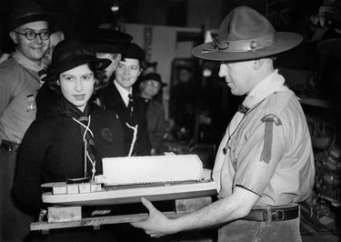 Princess Elizabeth of York, future Queen Elizabeth II, wearing the Sea Ranger's uniform, visits the Sea Scouts Exhibition, on November 1945, in London. (PLANET NEWS/AFP via Getty Images)