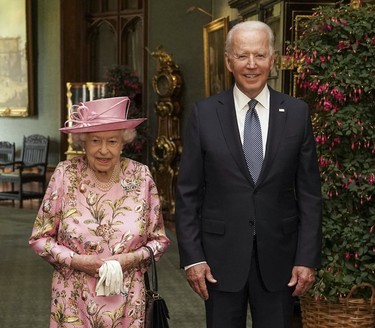 Queen Elizabeth II with US President Joe Biden in the Grand Corridor during their visit to Windsor Castle on June 13, 2021 in Windsor, England. Queen Elizabeth II hosts US President, Joe Biden and First Lady Dr Jill Biden at Windsor Castle. The President arrived from Cornwall where he attended the G7 Leader's Summit and will travel on to Brussels for a meeting of NATO Allies and later in the week he will meet President of Russia, Vladimir Putin. (Steve Parsons - WPA Pool/Getty Images)
