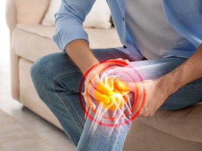 Photo illustration of a man suffering from knee pain.
