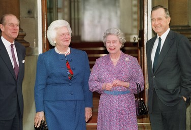 Britain's Queen Elizabeth II (2ndR) and Prince Philip (L) pose with former US President George Bush (R) and his wife Barbara (2ndL) 30 November 1993 after Bush had been awarded an honorary Knight Grand Cross of the Order of he Bath by the Queen at a private lunch in London. (JOHNNY EGGITT/AFP via Getty Images)