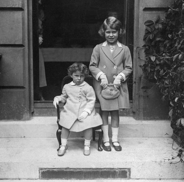 LONDON, UNITED KINGDOM:  Picture dated from the year 1933 of Princess Margaret (L), the younger sister of future Britain's Queen Elizabeth II (R). Margaret was born at Glamis Castle 21 August 1930. She was educated at home with her sister, and her first major state event was the coronation of her parents King George VI and Queen Elizabeth I (later Queen Mother).  (AFP via Getty Images)