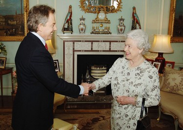 Newly re-elected Prime Minister Tony Blair shakes hands with Queen Elizabeth II during an engagement at Buckingham Palace May 6, 2005 in London. Blair was visiting the Queen to ask her permission to form a new government after the Labour party won a historic third term in office. (ROTA/Anwar Hussein Collection/Getty Images)