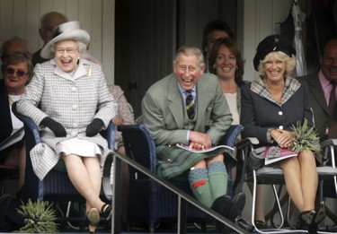 Queen Elizabeth II (from left), Prince Charles, The Prince of Wales and Camilla, Duchess of Cornwall watch competitors during the Braemar Gathering at the Princess Royal and Duke of Fife Memorial Park on September 2, 2006 in Braemar, Scotland. (Chris Jackson/Getty Images)