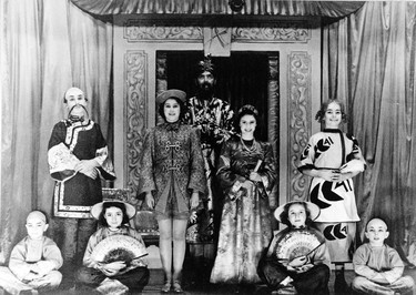 Princess Elizabeth (2nd left standing) stars as Aladdin opposite her sister, Princess Margaret (2nd right standing),  as they entertain the royal family and staff at Windsor Castle in 1943. The Queen recalled her starring role today (Thursday), when she met the cast of Harrogate Theatre's production of Aladdin and saw a snippet of the colourful show during a visit to the town. (FILES/AFP via Getty Images)