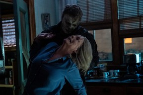 Michael Myers (aka The Shape) and Jamie Lee Curtis as Laurie Strode in Halloween Ends.