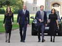 WINDSOR, ENGLAND - SEPTEMBER 10: Catherine, Princess of Wales, Prince William, Prince of Wales, Prince Harry, Duke of Sussex, and Meghan, Duchess of Sussex on the Long Walk at Windsor Castle arrive to view flowers and pay tribute to Queen Elizabeth.  On September 10, 2022 in Windsor, England.  Crowds gathered and tributes were left at the gates of Windsor Castle for Queen Elizabeth II, who died at Balmoral Castle on September 8, 2022. (Photo by Chris Jackson/Getty Images)
