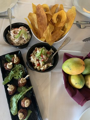 Lunch at Thatch and Barrel, an on-site restaurant at the birthplace of democracy in the Cayman Islands called Pedro St. James, has to begin with the kitchen’s Conch Fritters (far right) ... among other tasty dishes.