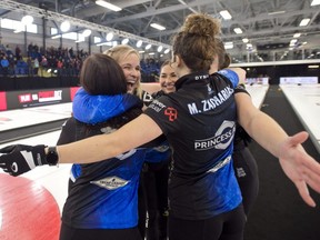 Team Jones skip Jennifer Jones, third.Karlee Burgess, lead Lauren Lenentine, second Mackenzie Zacharias and alternate Emily Zacharias celebrate after defeating Team Schiedegger at the PointsBet Invitational at the Willie O' Ree Place in Fredericton N.B., Sunday, Sept. 25, 2022.