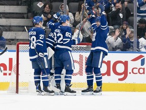 Toronto Maple Leafs centre Fraser Minten (39) celebrates the win with Toronto Maple Leafs defenseman Filip Kral (82) against the Ottawa Senators at the end of the third period at Scotiabank Arena.