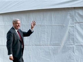 U.S. Senator Lindsey Graham (R-SC) waves at abortion rights protestors as he arrives to the Susan B. Anthony Pro-Life Americas annual gala and fundraising dinner at the National Building Museum in Washington, D.C, on Sept. 13, 2022.