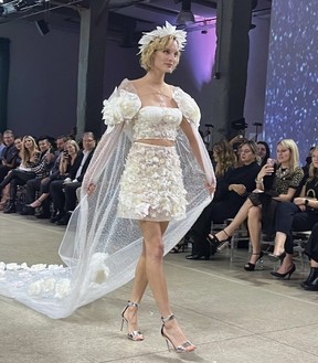 Unroll toilet paper on the podium for a good cause 5 Runway model on the recent Cashmere Celestial Awakening collection. Her dress shimmered every time she turned around – photo by Rita DeMontis