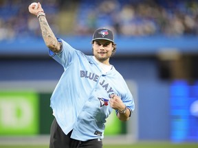 Maple Leafs star Auston Mattews throws out the ceremonial first pitch before the game between the New York Yankees and the Blue Jays at the Rogers Centre on Sept. 27, 2022.