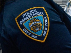 A logo of the New York City Police Department is seen in Times Square, Aug. 31, 2022.
