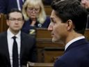 Prime Minister Justin Trudeau, watched by Conservative Party of Canada leader Pierre Poilievre, delivers remarks on the death of Britain's Queen Elizabeth in the House of Commons on Parliament Hill in Ottawa, Sept. 15, 2022.