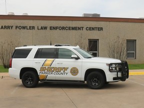 Parker County Sheriff's County vehicle in front of the Sheriff Larry Fowler Law Enforcement Center.