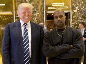 In this Dec. 13, 2016, file photo, President-elect Donald Trump and Kanye West pose for a picture in the lobby of Trump Tower in New York.