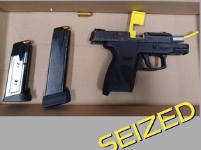 An image released by Durham cops of a handgun and ammunition allegedly seized during a traffic stop in Pickering on Sept. 25, 2022.