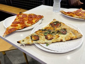 Slices of pizza from Pizza Di Joey, located inside Cross Street Market. EDDIE CHAU/TORONTO SUN