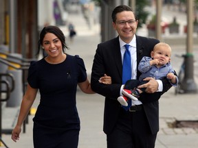 Conservative Party leader Pierre Poilievre, wife Anaida and son Cruz arrive at the National Conservative caucus meeting on Sept. 12, 2022 in Ottawa.