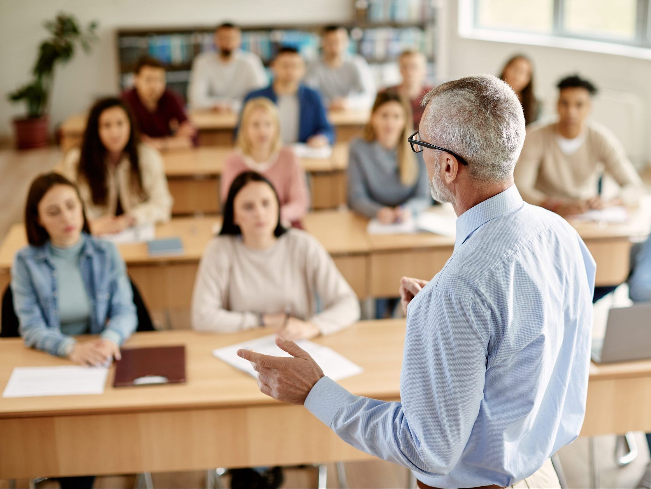 A professor lectures to students.
