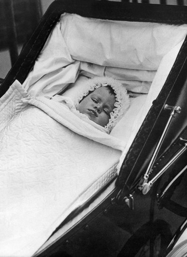 Britain's Princess Elizabeth is pictured in her baby carriage for her first outing on October 9, 1926. INTERNATIONAL NEWS PHOTOS (INP)/AFP via Getty Images)