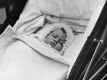 Britain's Princess Elizabeth is pictured in her baby carriage for her first outing on October 9, 1926. (Photo by - / various sources / AFP) / France ONLY (Photo by -/INTERNATIONAL NEWS PHOTOS (INP)/AFP via Getty Images)