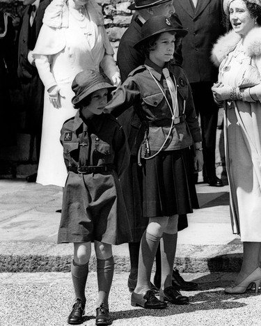 Picture taken on 1938 at Windsor Castle showing Princesses Margaret and Elizabeth, the future Queen Elizabeth II, during a girl "Guides" rally. (AFP via Getty Images)