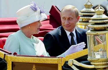 Russian President Vladimir Putin (R) and Queen (L) leave in an open carriage after the president was given a ceremonial welcome on Horse Guards Parade, by the Queen and the Duke of Edinburgh in London 24 June 2003.  (NICOLAS ASFOURI/AFP via Getty Images)