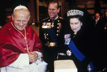 Queen Elizabeth II and her husband Prince Philip, Duke of Edinburgh with Pope John Paul II during the royal tour of Italy, in this 1980 undated photo. It has been announced by the Vatican April 1, 2005, Pope John Paul II has suffered serious heart failure and has been given his last rights. The 84-year-old Pontiff remained at the Vatican after deciding not to return to Rome’s Gemelli hospital. (Hulton Archive/Getty Images)