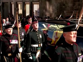 The coffin of the late Queen Elizabeth was taken along the Royal Mile in the Scottish capital Edinburgh on Monday September 12. Reuters screenshot,