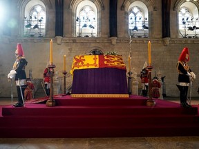 Queen Elizabeth II lies in state in an empty Palace of Westminster Hall ahead of the public being allowed in to pay their respects to the late Queen, in London, Wednesday, Sept. 14, 2022.